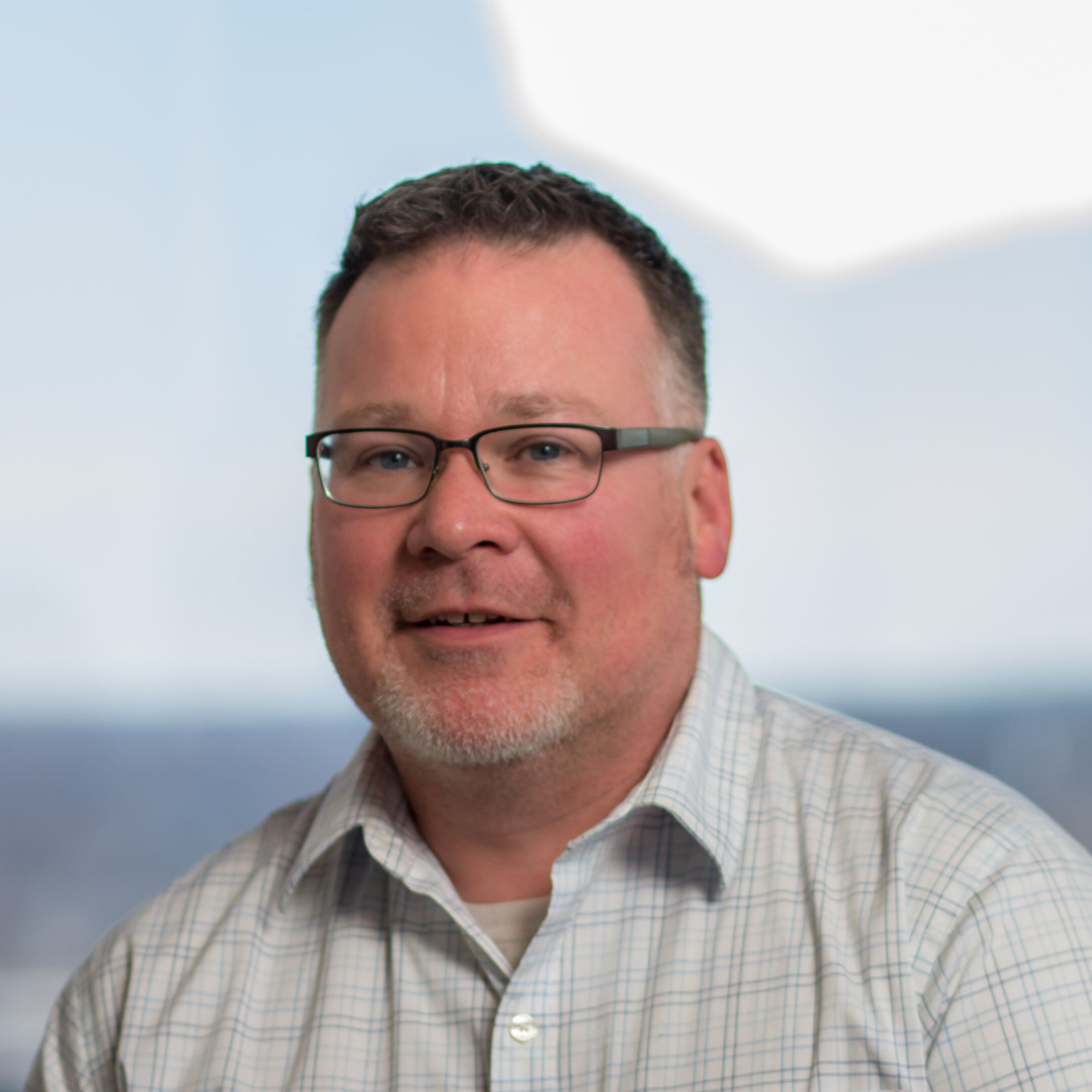 A headshot of John Duddy.