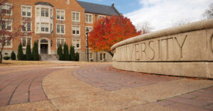 A photo of a engraved fountain on a university campus.