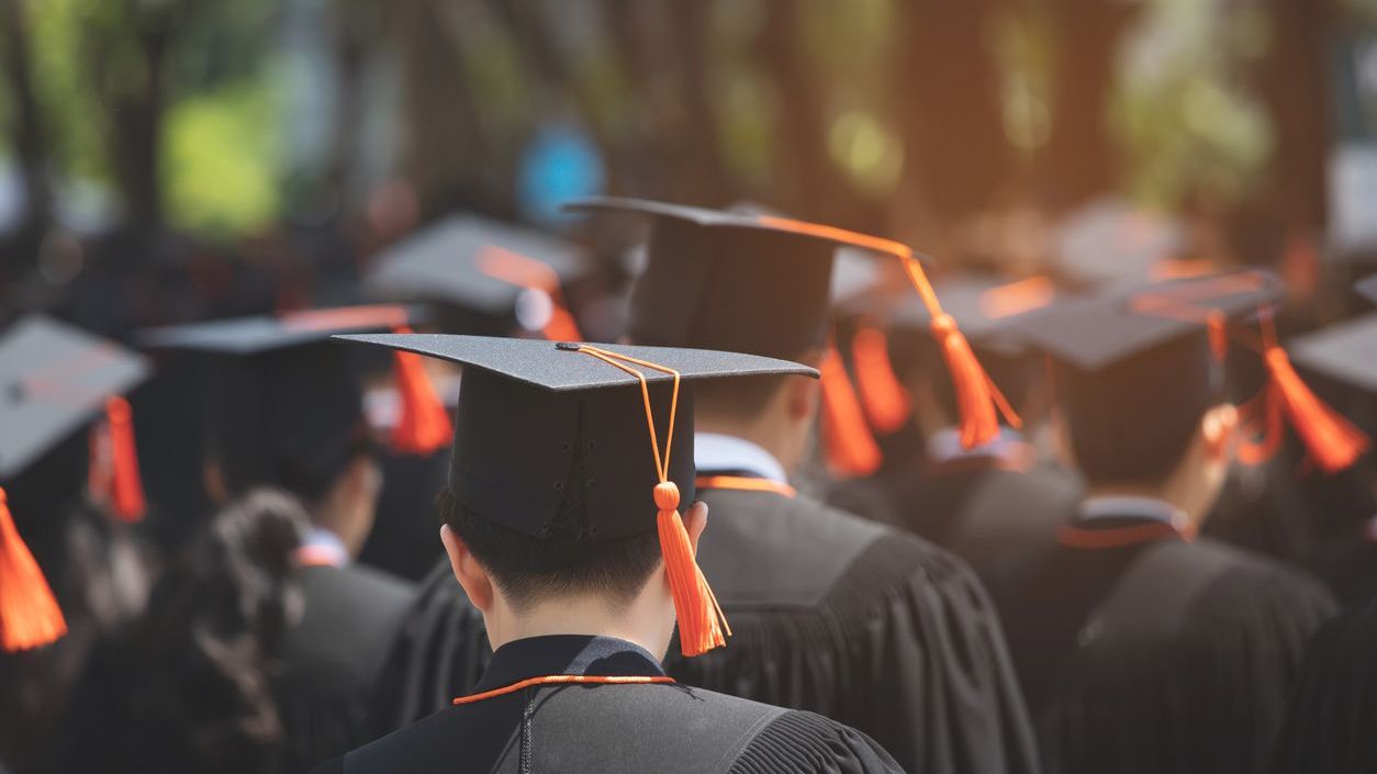Students sitting at a graduation ceremony.
